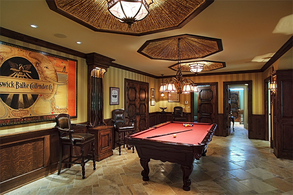 Beautiful wood trimmed room with pool table